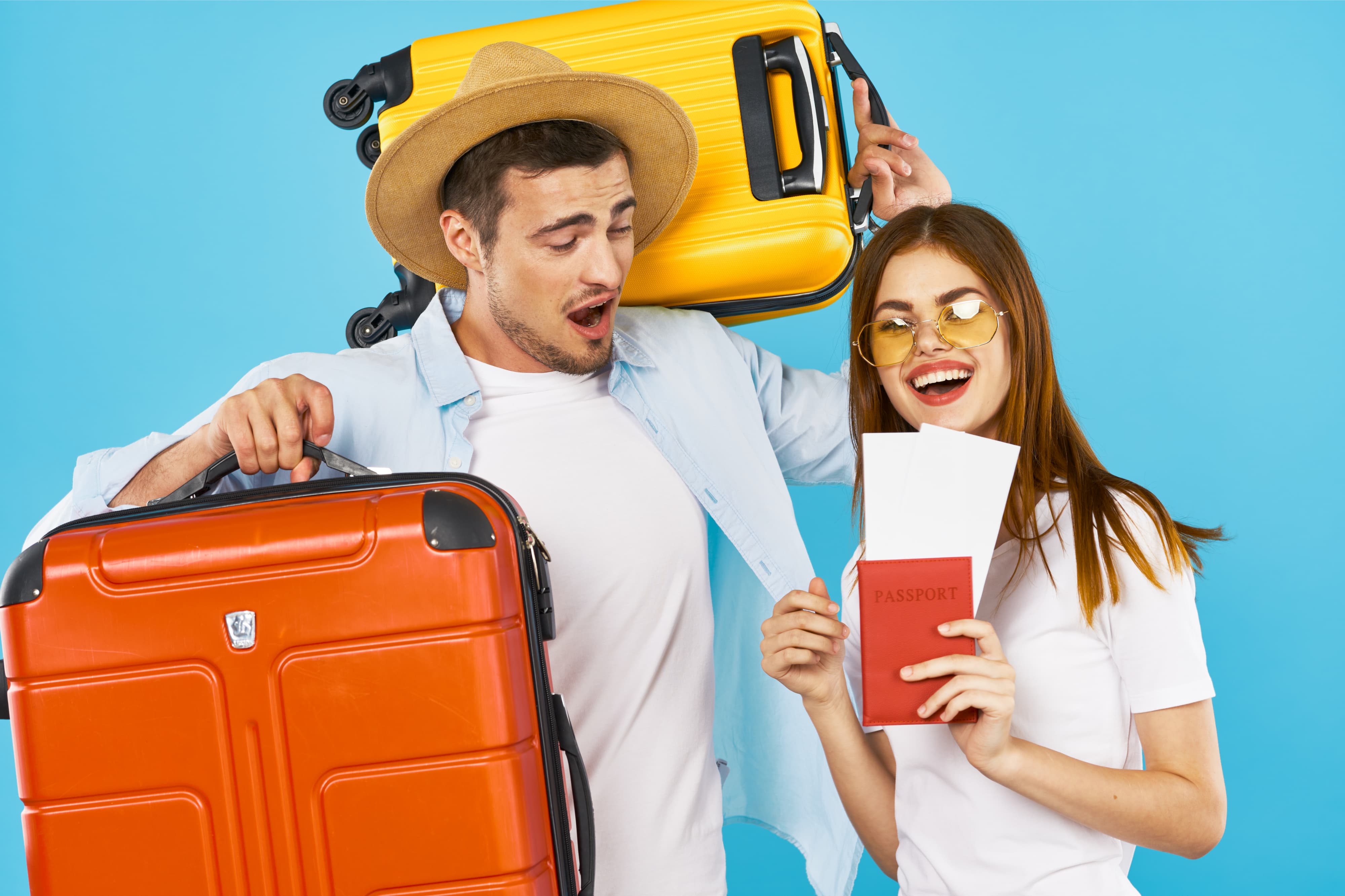 Young couple with suitcases tourism travel passport and plane ticket